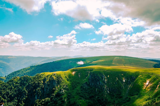 Clouds over green hills and ridges depicting Christ's journey to the Cross - Luke 23 Pontius Pilate