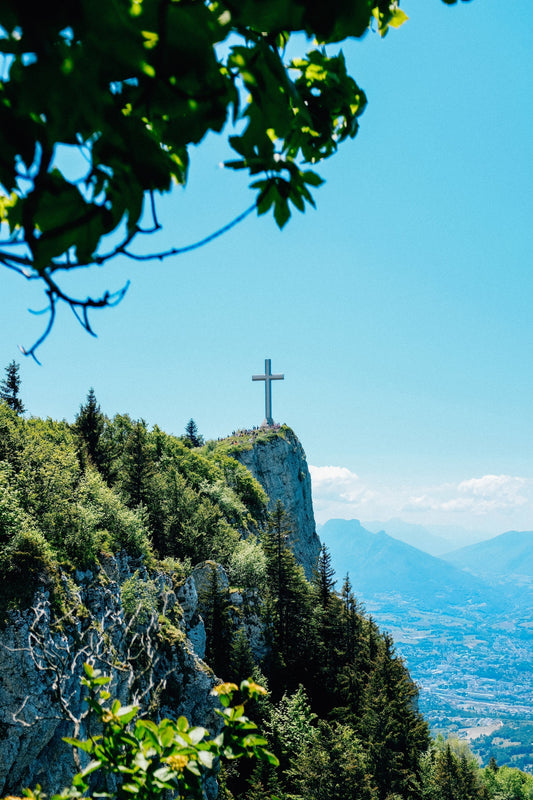 Cross atop mountain symbolizing God as fortress and refuge in Psalm 31, representing Jesus fulfilling messianic prophecy