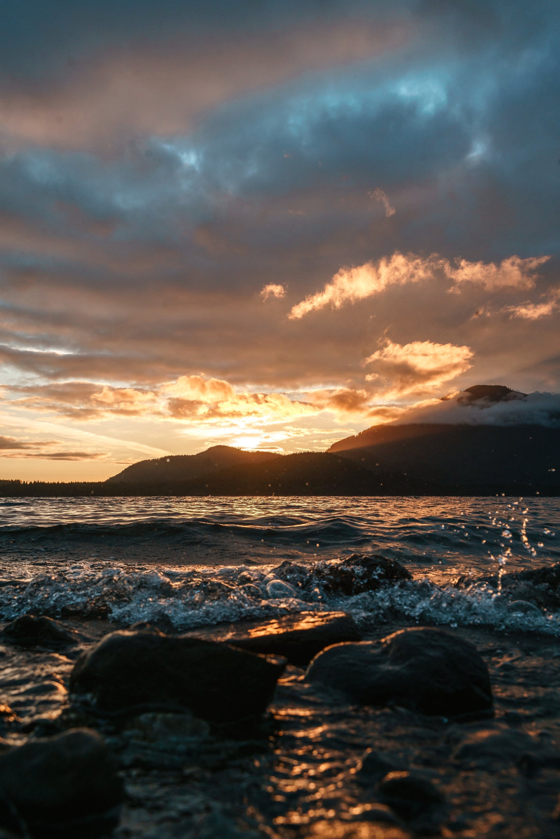 Sunset on rocky beach symbolizing the Great Commission and spreading the Gospel to all nations