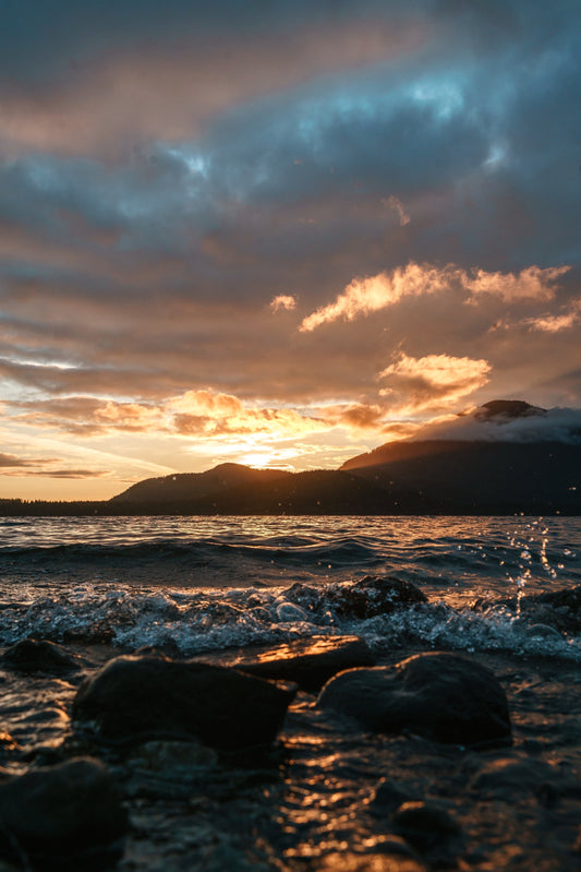 Sunset on rocky beach symbolizing the Great Commission and spreading the Gospel to all nations